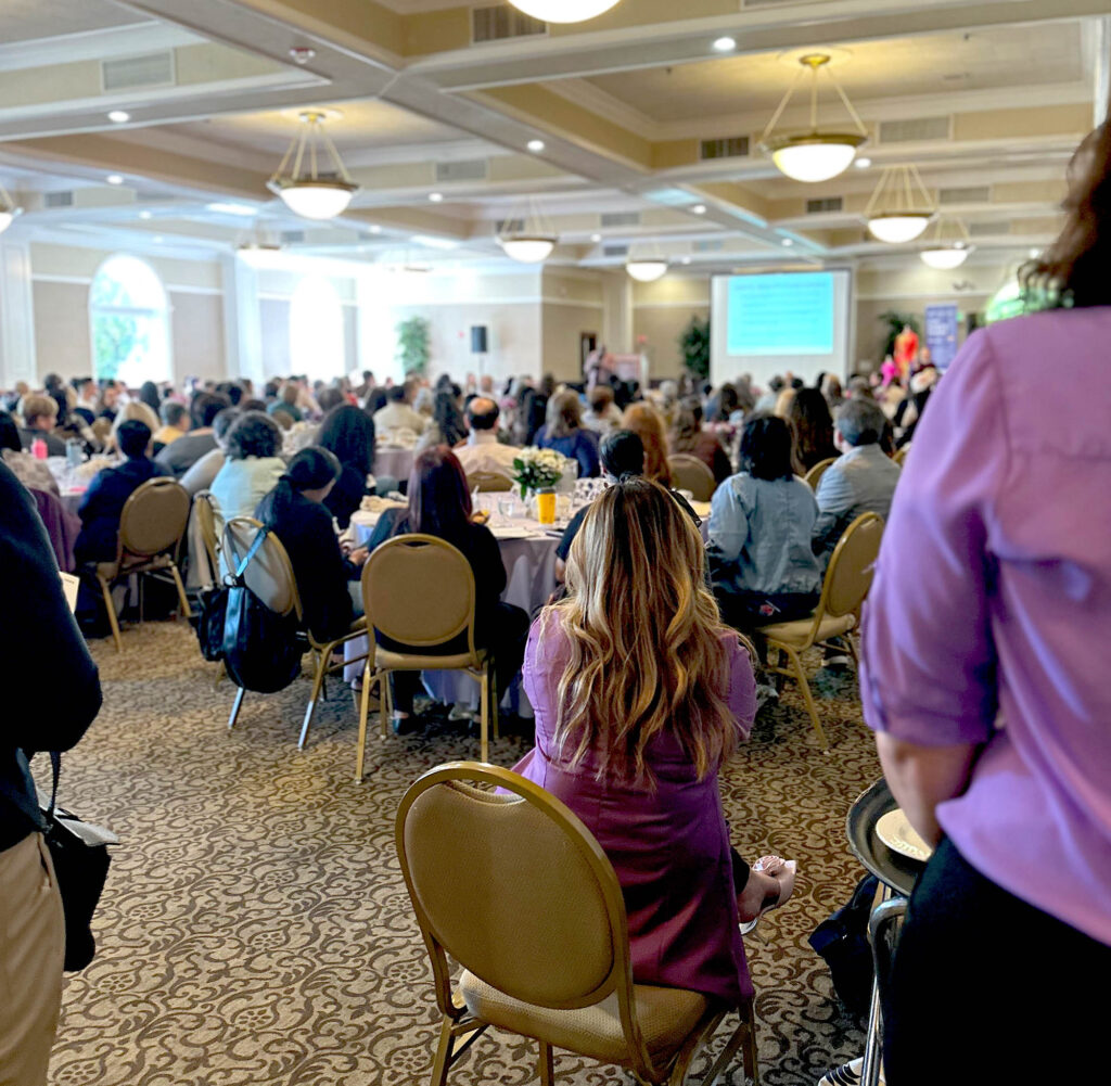 Behind audience at conference