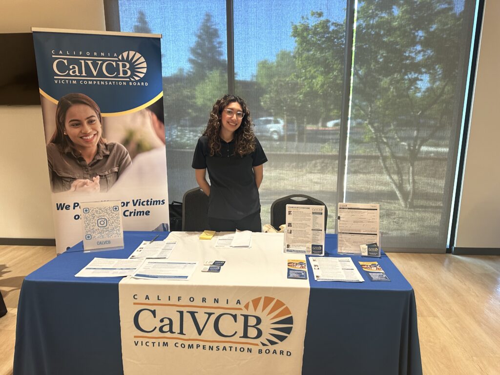 A women standing behind a table event